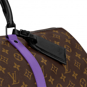 louis vuittons bandouliere embossed keepall 50