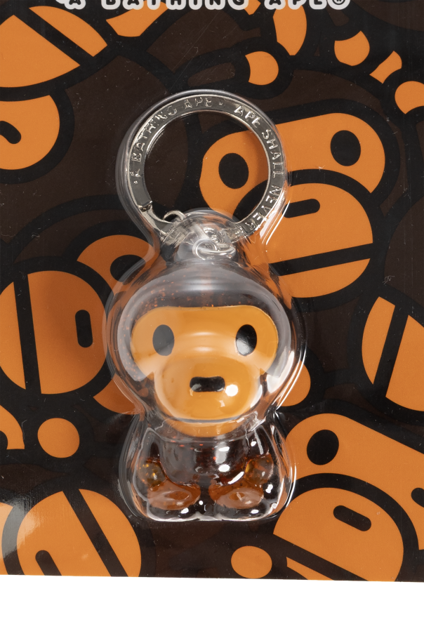 A BATHING APE® Keychain with a monkey motif