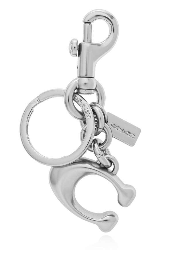 Keychain with a pendant in the shape of a logo od Coach