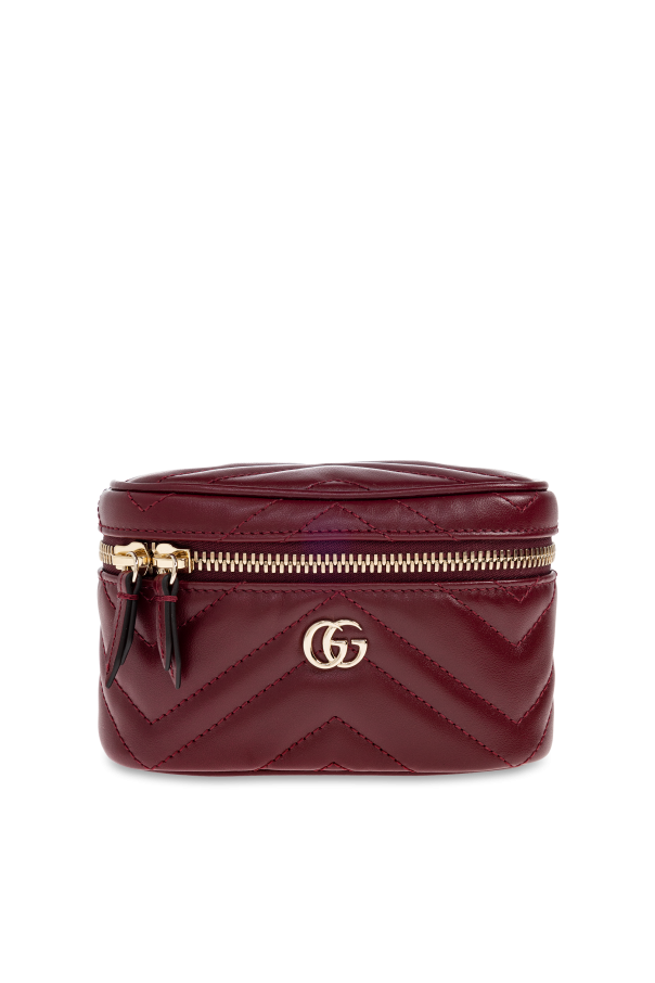 Cosmetic bag with chain shoulder strap od Gucci