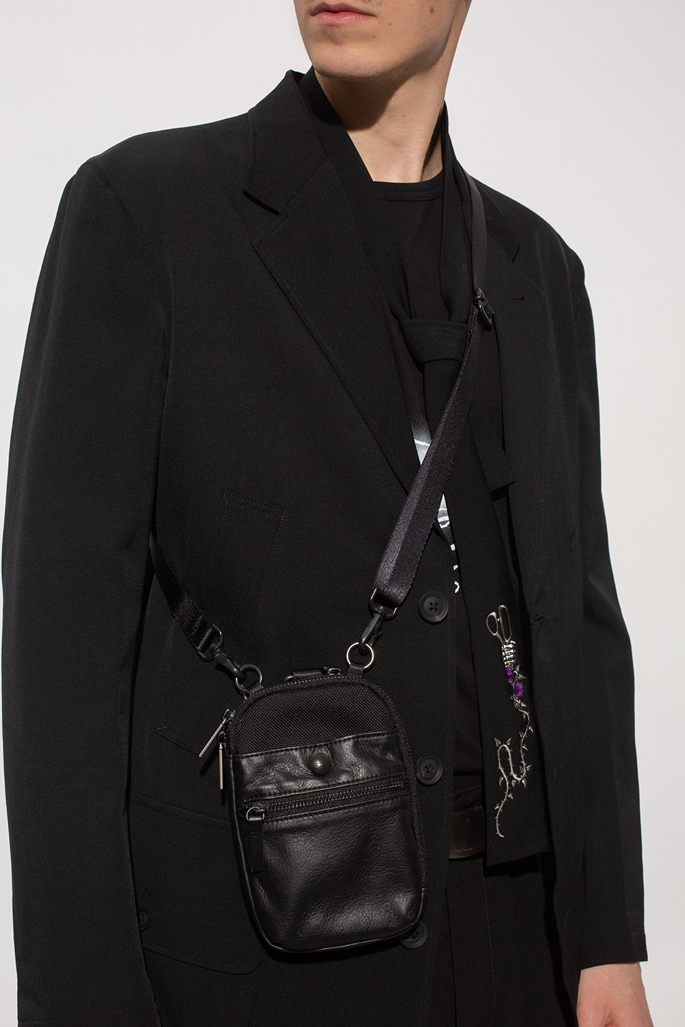 Yohji Yamamoto The 'Lauryn' cross-body bag is handcrafted from genuine