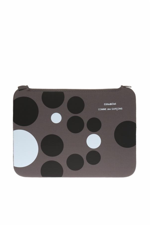 Grey tablet case from Comme des Garçons. Decorated with white and black print and logo Logo tablet case