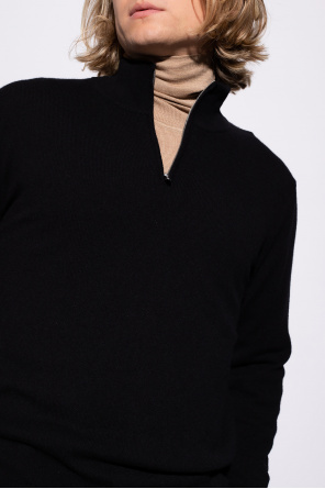 The Row Cashmere turtleneck wearing sweater