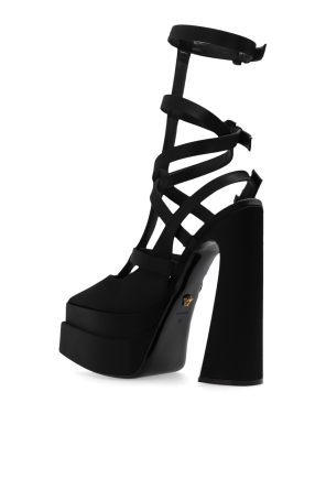 Versace Close up detail of Hailey Baldwins heeled sandals