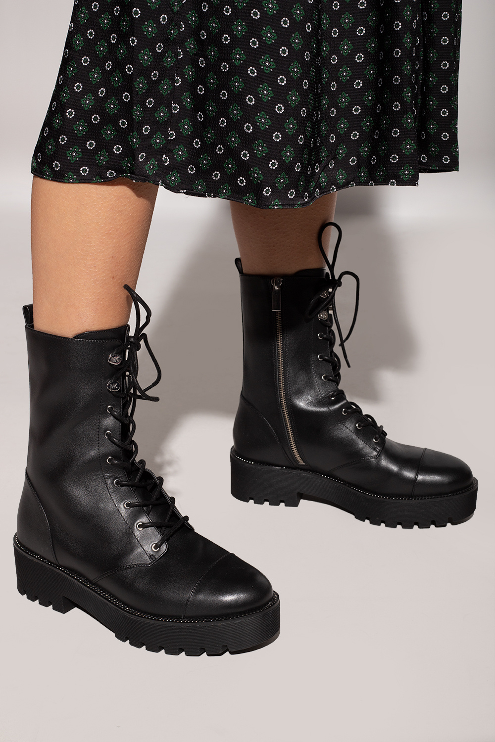 An edgy combat boot featuring functional laces and a 2.5 inch lug heel for added - Black ankle boots Michael Michael Kors - IetpShops Canada