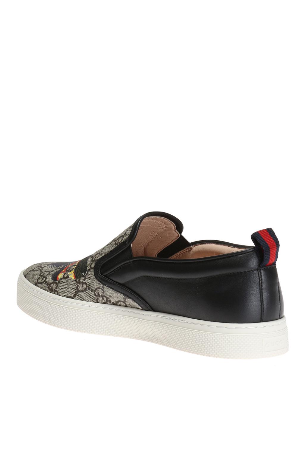 Shop the GG Supreme tiger slip-on sneaker by Gucci. A slip-on sneaker in GG  Supreme canvas with printe…