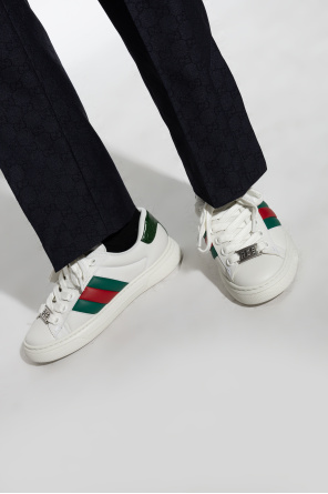 Sneakers with web strap od Gucci