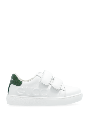 Sneakers with embossed logo