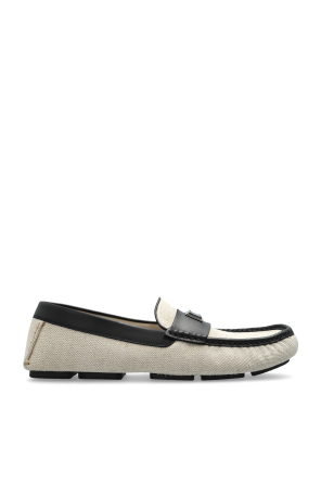 Loafers with an appliqué featuring an engraved logo