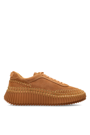 `Nama` sports shoes on a platform