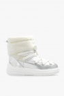 Lustrous pearlescent embellishments kick up a classic white sneaker in the