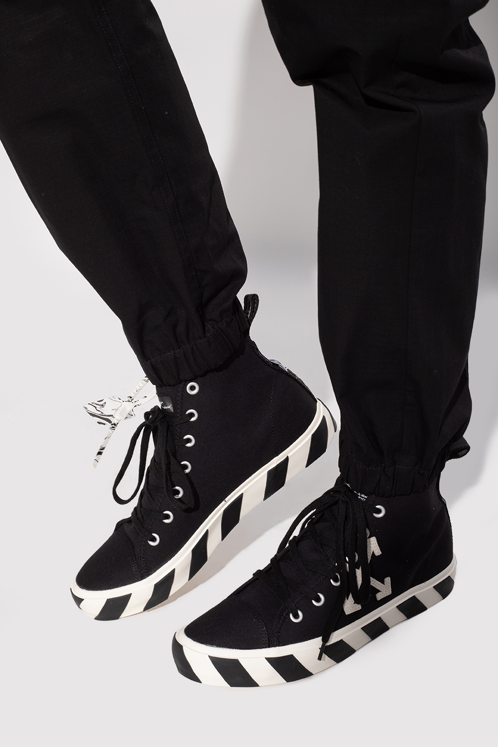 off white vulcanized high top sneakers