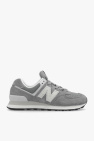 Takes a Golden Stroll in New Balance Sneakers That Come With Chic Details