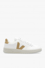 in a Leather Coat & All-White Veja Sneakers