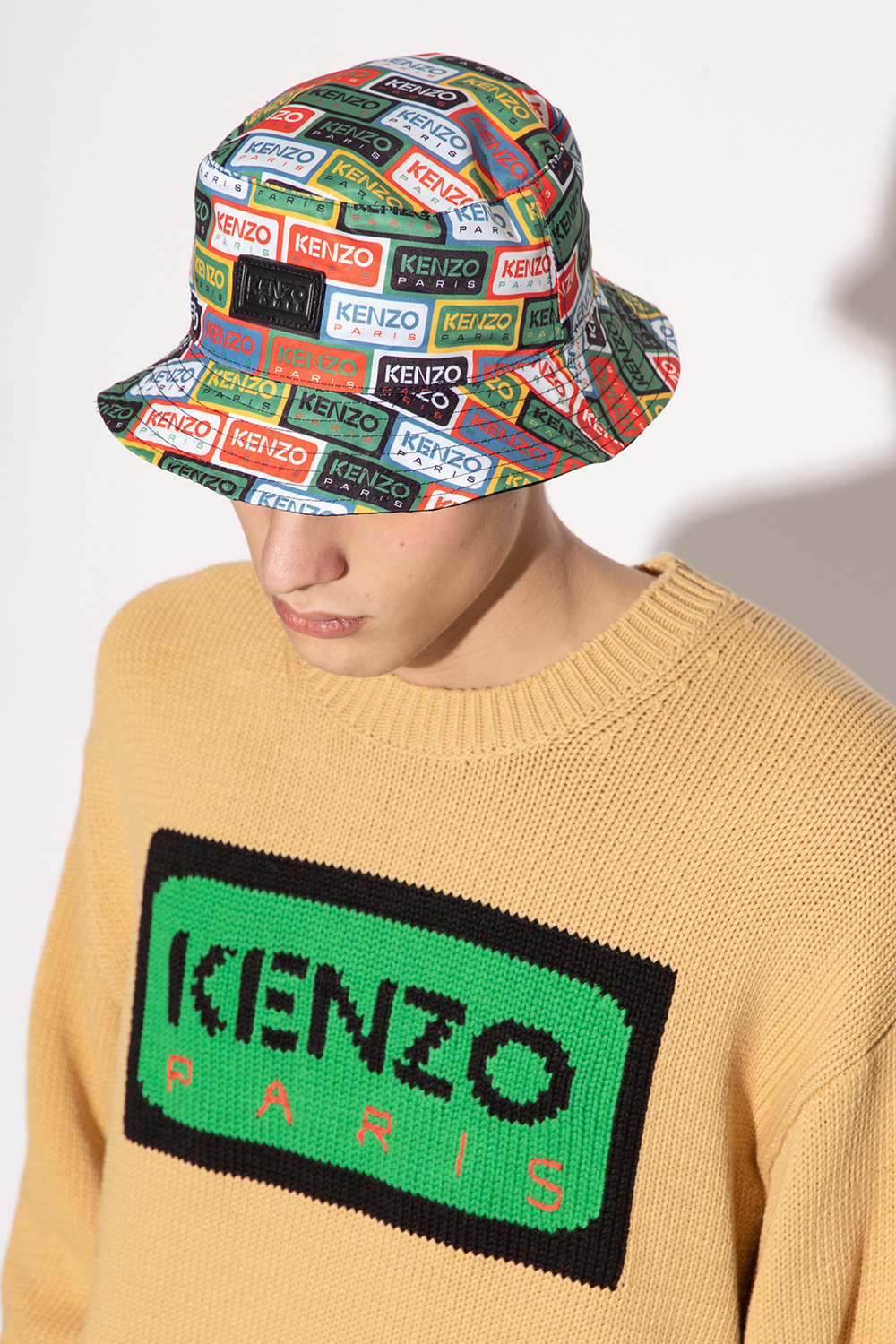 Kenzo Girl Power graphics make this fun pom hat Quaxar an essential winter hat Quaxar for your favorite ski bunny