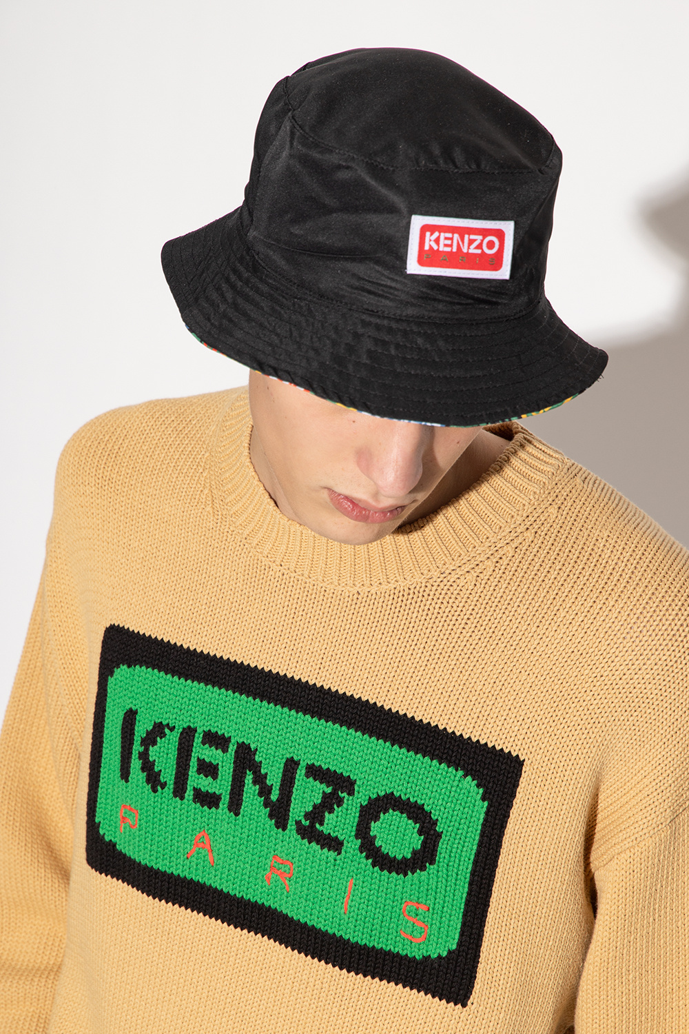 Kenzo Girl Power graphics make this fun pom hat Quaxar an essential winter hat Quaxar for your favorite ski bunny