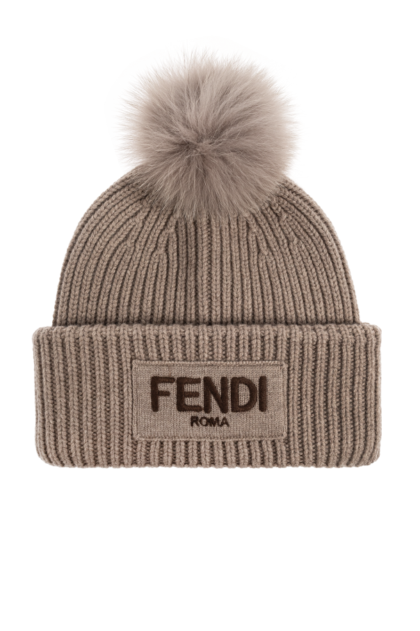 Hat with fur pompom od Fendi