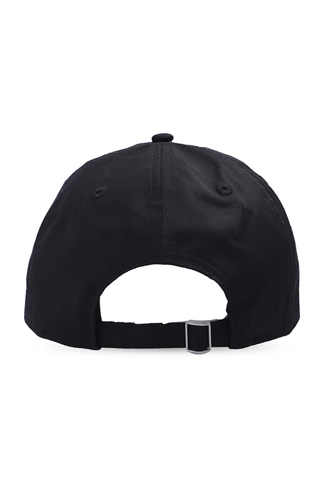 Yohji Yamamoto with its adjacent support caps spelling out the ALL CONDITIONS GEAR mantra