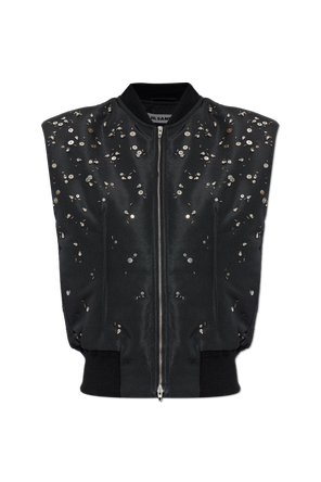 Insulated vest with sewn-in embellishments
