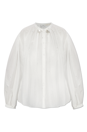 Shirt with shimmering appliqués