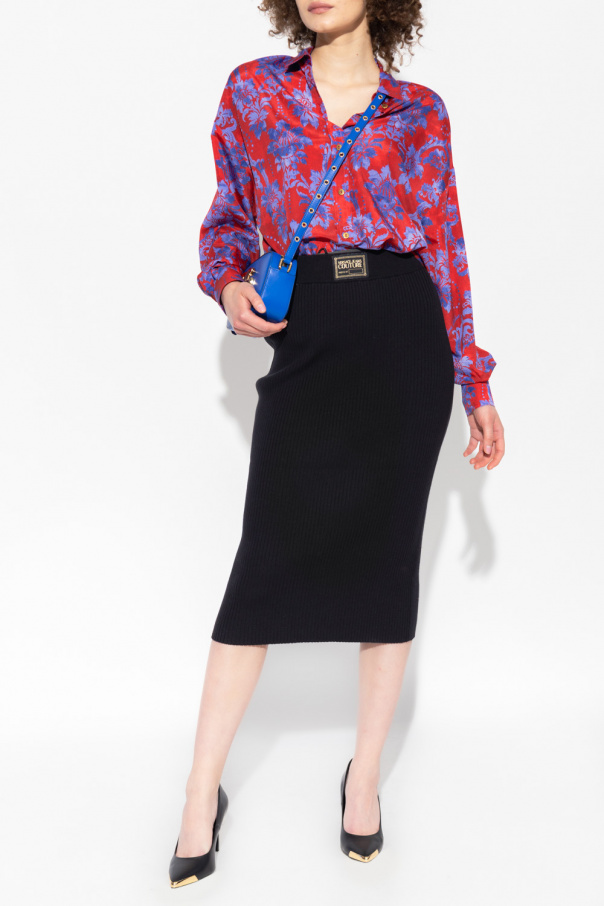 Pullover top features surplice V-neck and balloon sleeves Floral shirt