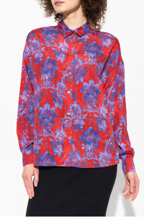 Pullover top features surplice V-neck and balloon sleeves Floral shirt