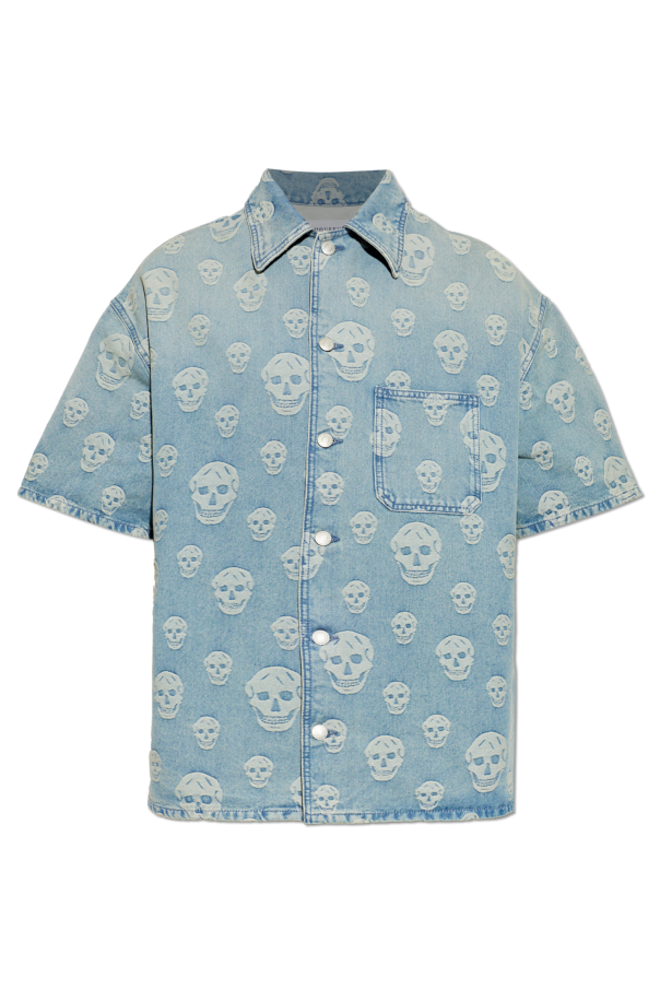 Denim shirt with a distinctive skull motif od Alexander McQueen