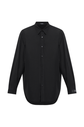 Camisa con parche en el puño