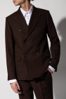 with a pullover construct and sweeping v-neck Blazer with notched lapels