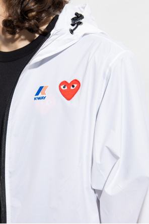 Comme des Garçons Play is a reverse slub cotton t-shirt with exposed seams and printed graphic art on front and back