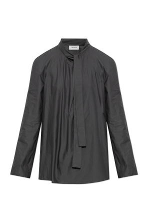 Top with decorative tie at the neckline