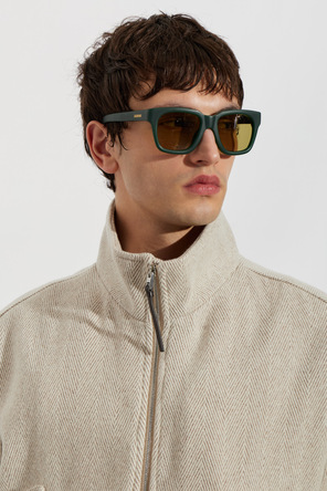 Jacquemus Sonnenbrille mit grünen Gestellen und gelben Gläsern
