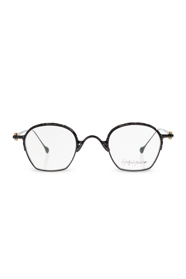 Glasses with a slim metal frame and rounded, slightly octagonal
profile od Yohji Yamamoto