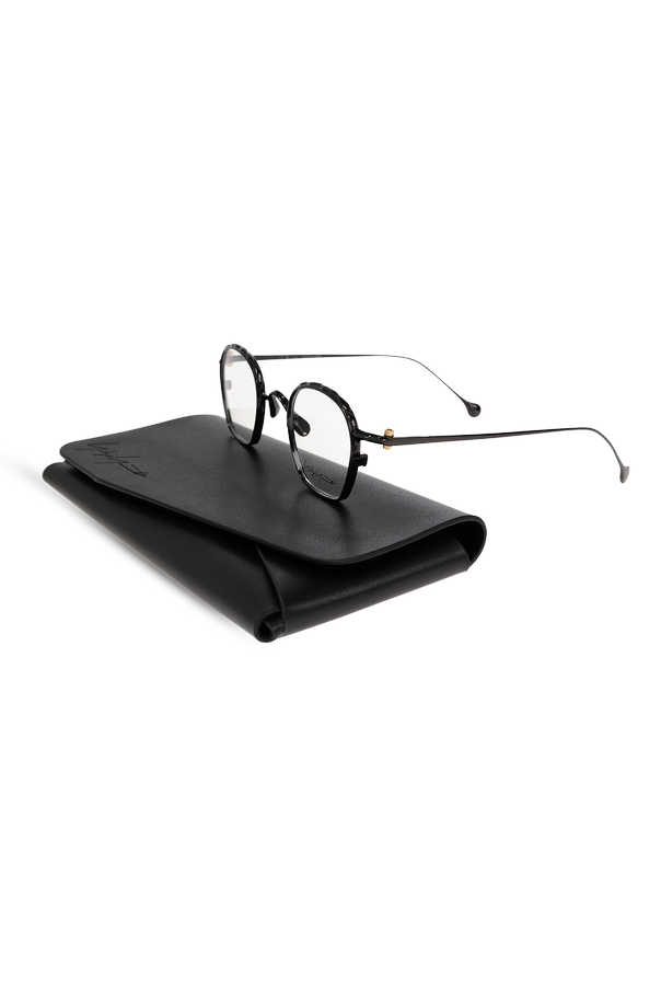 Yohji Yamamoto Glasses with a slim metal frame and rounded, slightly octagonal profile