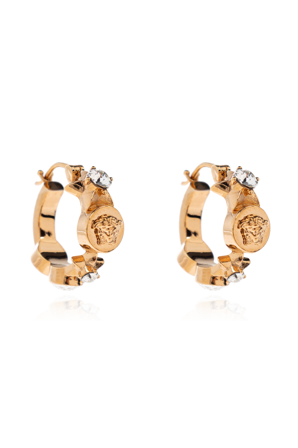 Earrings with shimmering crystals od Versace