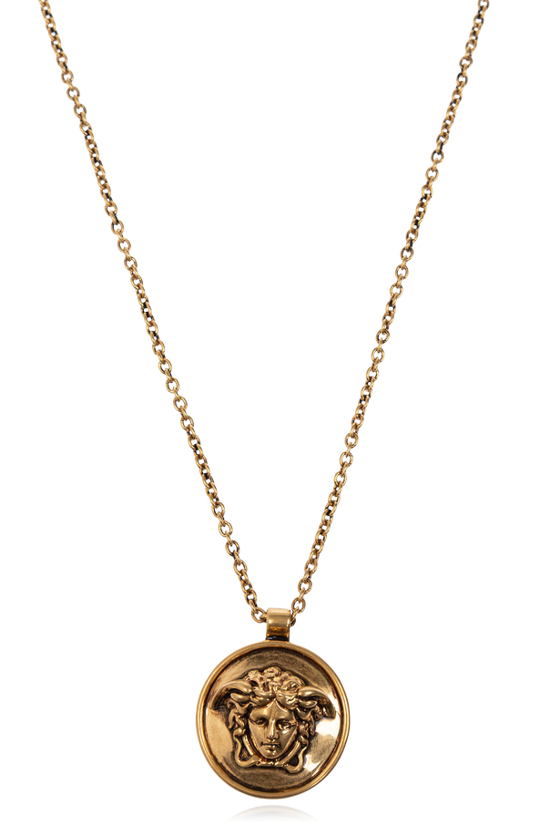 Gold Medusa head necklace od Versace