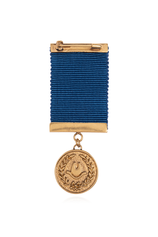 Moschino Broche con colgante