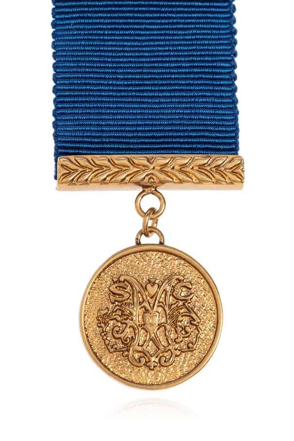 Moschino Broche con colgante