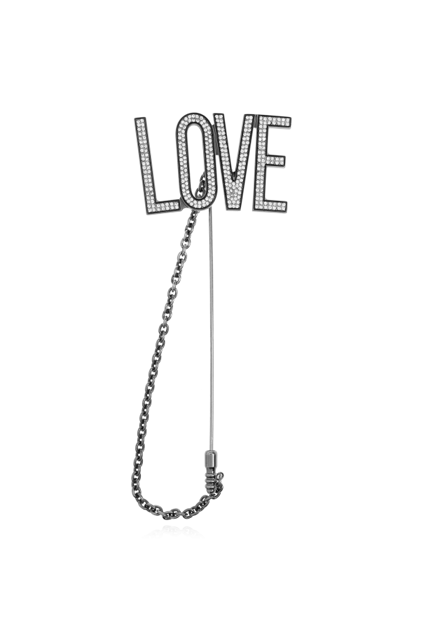 Brooch with the inscription `LOVE` od Moschino