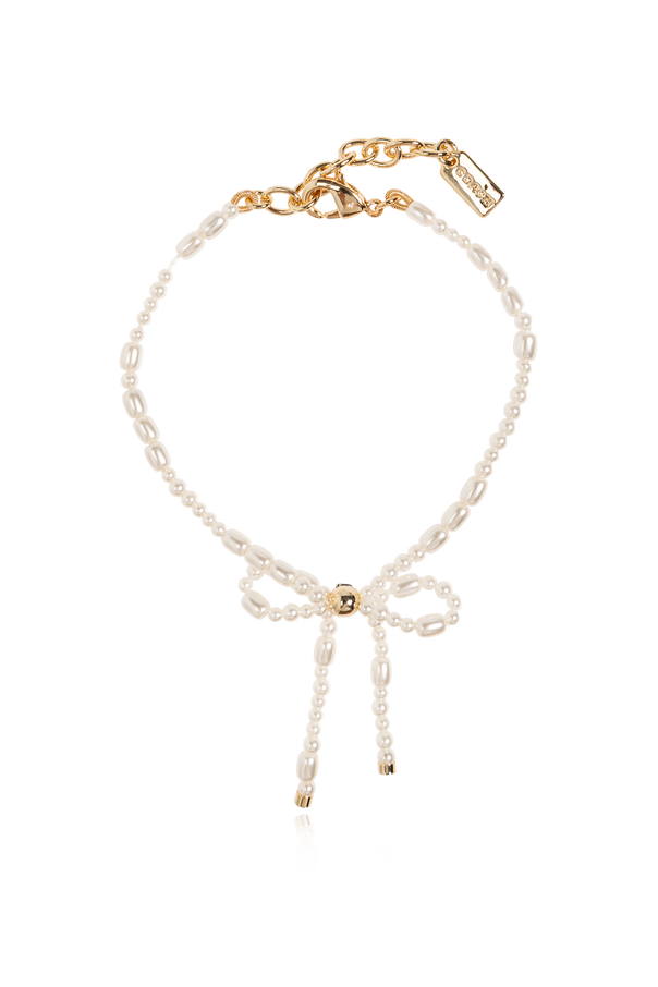 Bracelet with a decorative bow od Coach