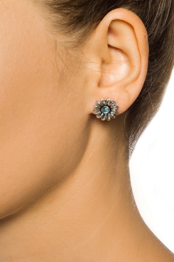 Gucci Silver earrings in the shape of a logo and a flower.