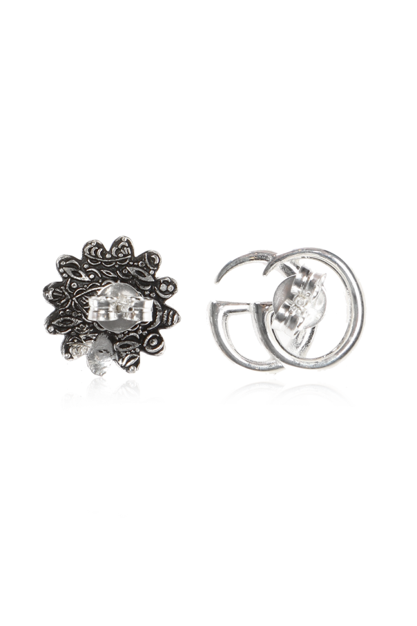 Gucci Silver earrings in the shape of a logo and a flower.