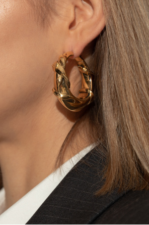 Brass earrings od Alexander McQueen
