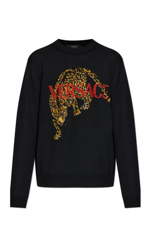 Sweater with shimmering appliqués