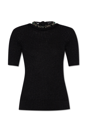 Top z połyskującymi aplikacjami