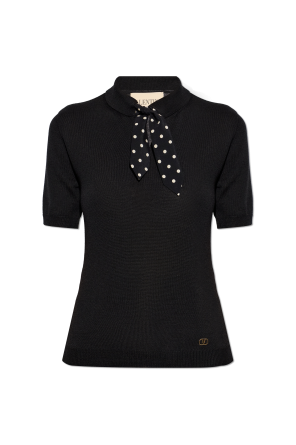 Top with decorative tie at the neckline