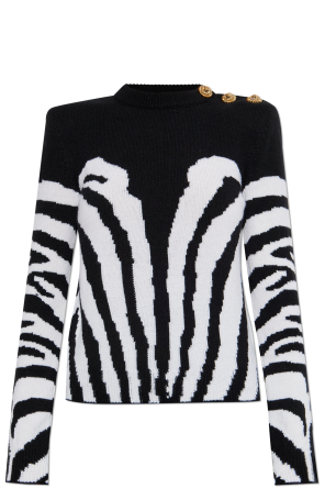 Sweater with decorative buttons on the shoulder