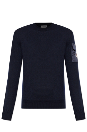 Sweater with a sleeve pocket