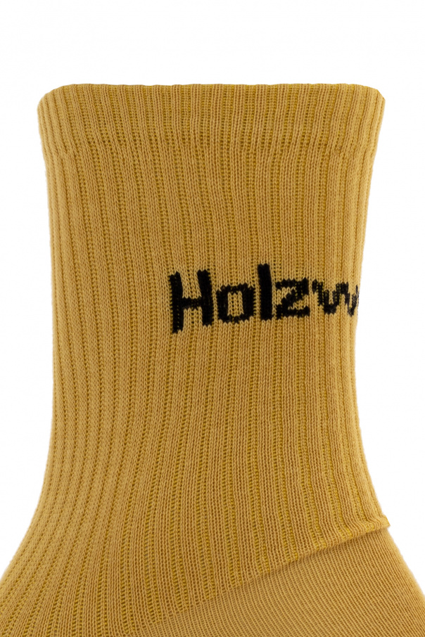 Holzweiler Yellow socks from . Crafted from bamboo viscose, this pair features ribbed cuffs and a black logo