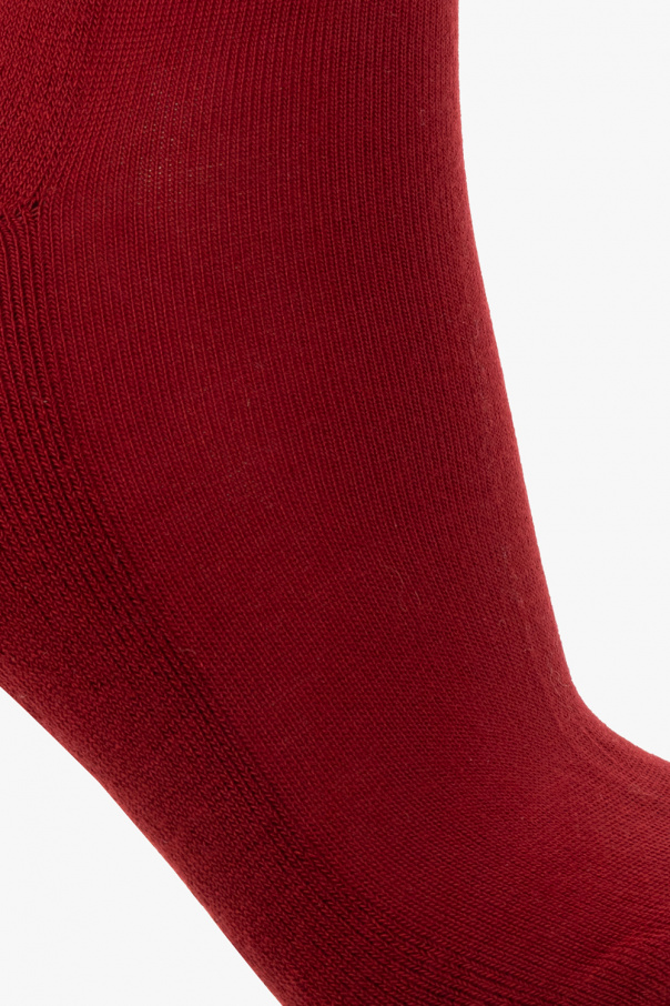 Holzweiler Red socks with a black logo embroidery and ribbed cuffs from